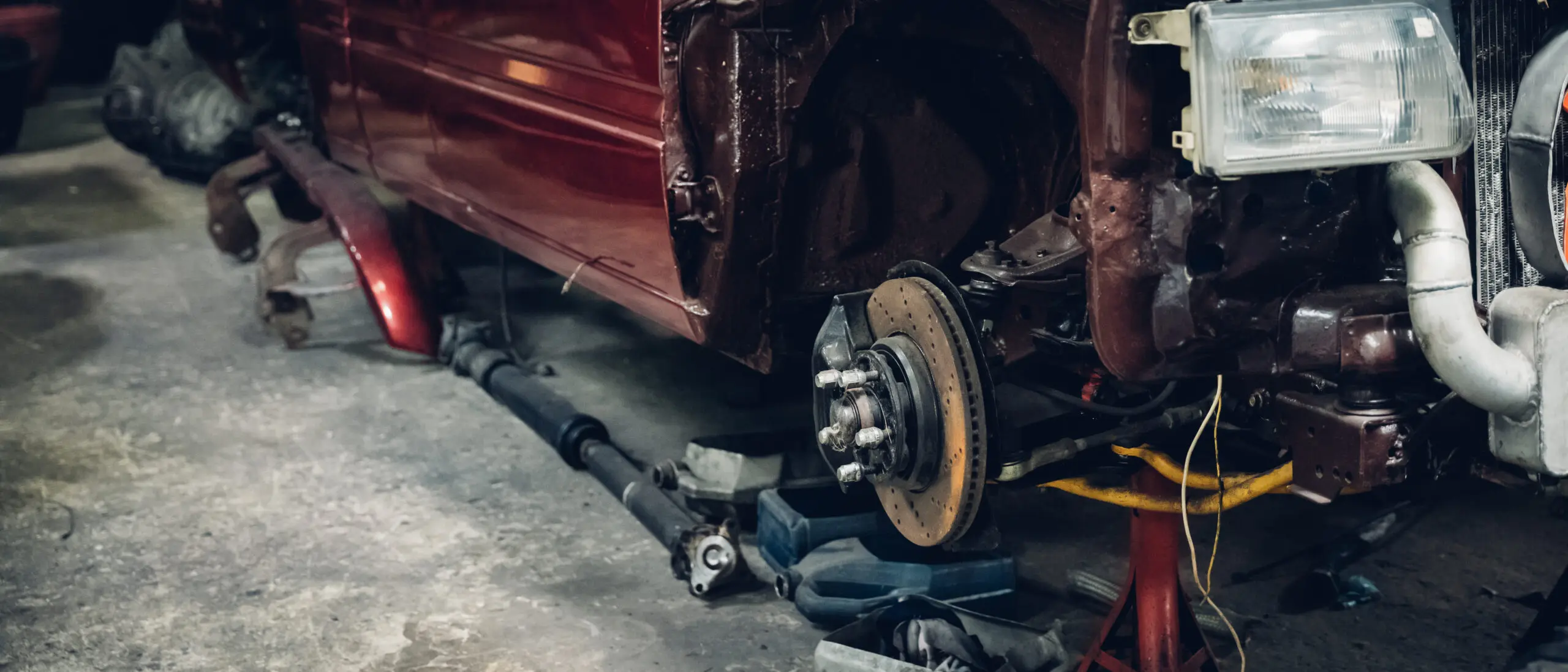 Brakes on the car and different equipment in a garage