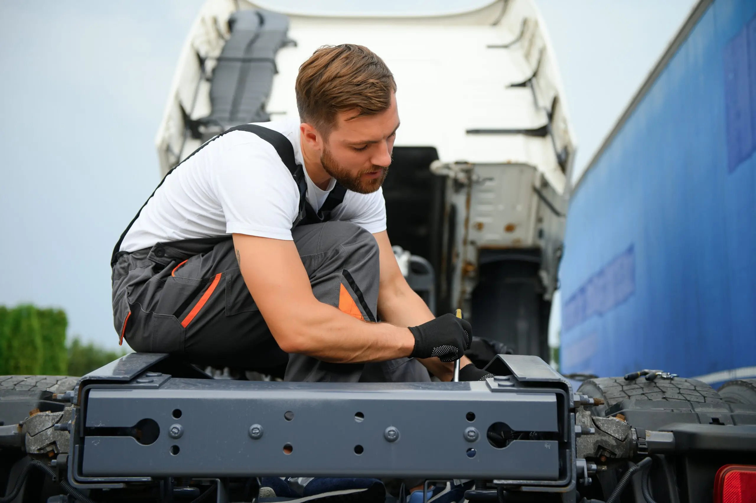Professional truck mechanic working in vehicle repair service
